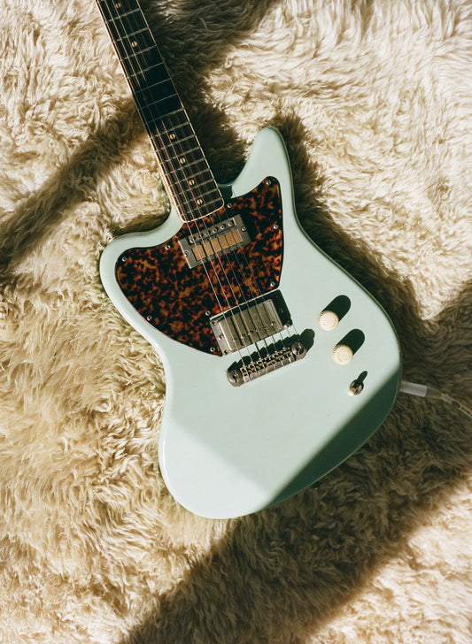 guitar on rug